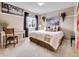 Bedroom featuring a comfortable bed, desk, and stylish decor at 10062 Eagle Valley Way, Highlands Ranch, CO 80129