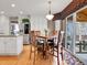 Eat-in kitchen dining area boasts wood floors, a slider to the backyard, and ample natural light at 10062 Eagle Valley Way, Highlands Ranch, CO 80129