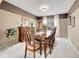 Elegant dining room featuring a large table, ornate chairs, and ample natural light, perfect for hosting gatherings at 10062 Eagle Valley Way, Highlands Ranch, CO 80129