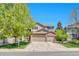 Charming two-story home with a three-car garage and well-manicured lawn, perfect for suburban living at 10062 Eagle Valley Way, Highlands Ranch, CO 80129