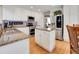 Well-lit kitchen offers granite countertops, stainless steel appliances, and a convenient center island at 10062 Eagle Valley Way, Highlands Ranch, CO 80129