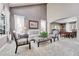 Bright living room featuring vaulted ceiling, neutral decor, and dining area, creating a welcoming atmosphere at 10062 Eagle Valley Way, Highlands Ranch, CO 80129