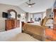 Spacious main bedroom boasts a sitting area, large window, ceiling fan, and decorative furniture at 10062 Eagle Valley Way, Highlands Ranch, CO 80129