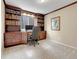 Home office with custom built-in bookshelves, a spacious desk area, and a quiet atmosphere for productivity at 10062 Eagle Valley Way, Highlands Ranch, CO 80129