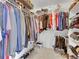 Well-organized walk-in closet with ample storage, shelving, and hanging space for clothes and shoes at 10062 Eagle Valley Way, Highlands Ranch, CO 80129
