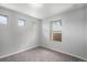 Bright bedroom with gray carpet and three windows at 3116 Jonquil St, Castle Rock, CO 80109