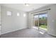 Bright bedroom with gray carpet and sliding door that opens to the backyard at 3116 Jonquil St, Castle Rock, CO 80109