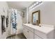 Bathroom featuring vanity with sink, shower with tub, and modern finishes at 12818 Ironstone Way # 101, Parker, CO 80134