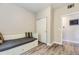 Bright bedroom features a built-in bed with drawers and modern gray wood flooring at 12818 Ironstone Way # 101, Parker, CO 80134