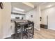 Open dining area with table and chairs, seamlessly connected to the kitchen, featuring wood floors at 12818 Ironstone Way # 101, Parker, CO 80134