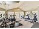 Spacious gym with weights and cardio equipment, offering a comprehensive fitness center for residents of the community at 12818 Ironstone Way # 101, Parker, CO 80134