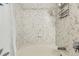 Clean, well-maintained shower featuring decorative tile work at 12818 Ironstone Way # 101, Parker, CO 80134