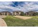 Scenic view of community buildings and sand volleyball court, creating an active and engaging recreational area for residents at 12818 Ironstone Way # 101, Parker, CO 80134