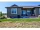 Green backyard showcasing well-maintained lawn and a patio area perfect for outdoor entertaining at 3375 New Haven Cir, Castle Rock, CO 80109