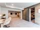 Finished basement area with an open floor plan, a desk area, and rustic wood accents at 3375 New Haven Cir, Castle Rock, CO 80109