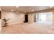 Spacious finished basement with a projector, open space, and access to more rooms at 3375 New Haven Cir, Castle Rock, CO 80109