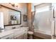 Cozy bathroom with a tiled shower, white vanity, framed mirror, and accent lighting at 3375 New Haven Cir, Castle Rock, CO 80109