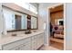 Bright bathroom featuring a double vanity with marble countertops and neutral walls at 3375 New Haven Cir, Castle Rock, CO 80109