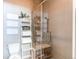 Bathroom with white tiled shower with a glass door and a ladder shelf filled with white towels at 3375 New Haven Cir, Castle Rock, CO 80109