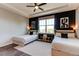 Stylish bedroom showcasing two beds, modern decor, and plenty of natural light at 3375 New Haven Cir, Castle Rock, CO 80109