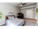 Comfortable bedroom with a ceiling fan, a window, and a desk area for work or study at 3375 New Haven Cir, Castle Rock, CO 80109