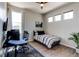 Cozy bedroom features modern decor, ample natural light, and wood floors at 3375 New Haven Cir, Castle Rock, CO 80109