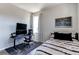 Comfortable bedroom with computer desk, large window, and modern decor at 3375 New Haven Cir, Castle Rock, CO 80109