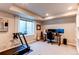 Spacious room with exercise equipment, a computer setup, and natural light at 3375 New Haven Cir, Castle Rock, CO 80109