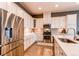 Well-equipped kitchen featuring stainless steel appliances, white cabinets, and stylish backsplash at 3375 New Haven Cir, Castle Rock, CO 80109