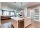 Bright kitchen featuring a large island, stainless steel appliances, and pendant lighting at 3375 New Haven Cir, Castle Rock, CO 80109