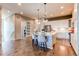 Updated kitchen featuring white cabinets, stainless steel appliances, and a center island with bar seating at 3375 New Haven Cir, Castle Rock, CO 80109