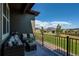 Cozy patio featuring outdoor seating, a black railing and scenic views at 3375 New Haven Cir, Castle Rock, CO 80109