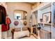 Chic walk-in closet features seating area and ample space for clothes and accessories at 3375 New Haven Cir, Castle Rock, CO 80109