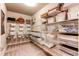 Large walk-in closet with multiple storage shelves and bins, ideal for organization at 3375 New Haven Cir, Castle Rock, CO 80109