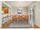 Bright and airy dining room with chandelier and sliding door to backyard at 812 Union St # B, Lakewood, CO 80401