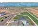 Panoramic aerial view showcasing the neighborhood's layout, green spaces, and mountain backdrop at 5805 Red Barn Ave, Mead, CO 80504