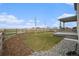 Well-maintained backyard with a small lawn, some saplings, and a covered patio area at 5805 Red Barn Ave, Mead, CO 80504