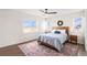 Comfortable bedroom with a cozy rug, natural light, and neutral decor at 5805 Red Barn Ave, Mead, CO 80504