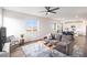 Bright living room featuring modern decor, a large window, and an open layout at 5805 Red Barn Ave, Mead, CO 80504