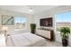 Comfortable bedroom with a large window, mounted TV, and stylish furniture at 5805 Red Barn Ave, Mead, CO 80504