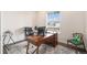 Functional home office space with a large desk, natural light, and stylish decor at 5805 Red Barn Ave, Mead, CO 80504