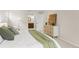 Bright bedroom featuring modern dresser and ensuite bathroom access, creating a comfortable, private retreat at 6602 S Vance St, Littleton, CO 80123