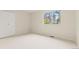 Cozy carpeted room with closet and sunny window at 6602 S Vance St, Littleton, CO 80123