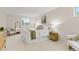 Bright bedroom features a large window and white linens with olive green accents at 6602 S Vance St, Littleton, CO 80123