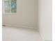 Bright bedroom featuring neutral walls, carpet, and a window providing natural light at 6602 S Vance St, Littleton, CO 80123