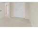 Bedroom featuring carpeting, a closet, and an interior door at 6602 S Vance St, Littleton, CO 80123