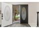 Inviting entryway with decorative glass doors, creating a warm welcome into the home at 6602 S Vance St, Littleton, CO 80123
