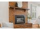 A classic brick fireplace provides a focal point in this inviting living space at 6602 S Vance St, Littleton, CO 80123