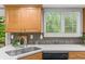 Close up view of the bright kitchen featuring stainless appliances and a breakfast bar at 6602 S Vance St, Littleton, CO 80123