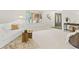 Bright living room with white sofa, textured rug, and stylish decor, perfect for relaxation at 6602 S Vance St, Littleton, CO 80123